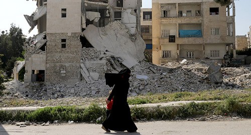 Война в Сирии. Женщина с ребенком. Фото: REUTERS/Khalil Ashawi Война в Сирии. Женщина с ребенком. Фото: REUTERS/Khalil Ashawi