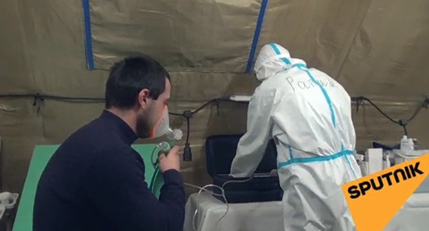 Работа врача мобильного военного госпиталя в Абхазии. Кадр видео Спутник-Абхазия https://sputnik-abkhazia.ru/Abkhazia/20210203/1031762147/Rabota-mobilnogo-gospitalya-Minoborony-Rossii-v-Abkhazii-zavershitsya-15-fevralya.html?utm_source=yxnews&utm_medium=desktop&nw=1612418994000 Работа врача мобильного военного госпиталя в Абхазии. Кадр видео Спутник-Абхазия https://sputnik-abkhazia.ru/Abkhazia/20210203/1031762147/Rabota-mobilnogo-gospitalya-Minoborony-Rossii-v-Abkhazii-zavershitsya-15-fevralya.html?utm_source=yxnews&utm_medium=desktop&nw=1612418994000